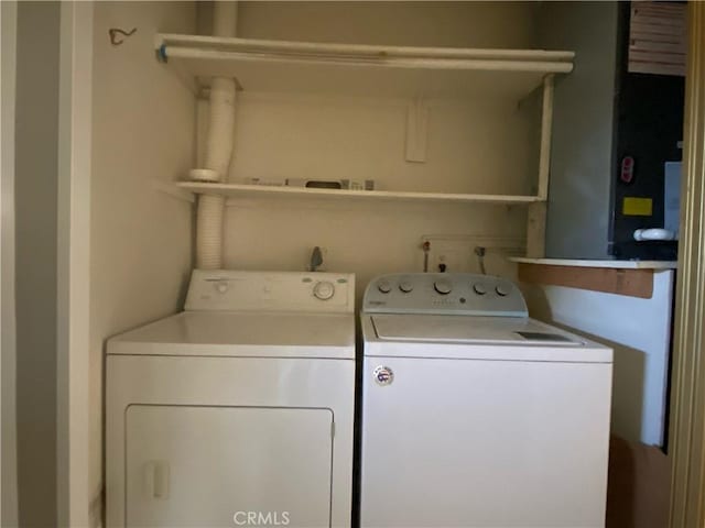 clothes washing area featuring laundry area and separate washer and dryer