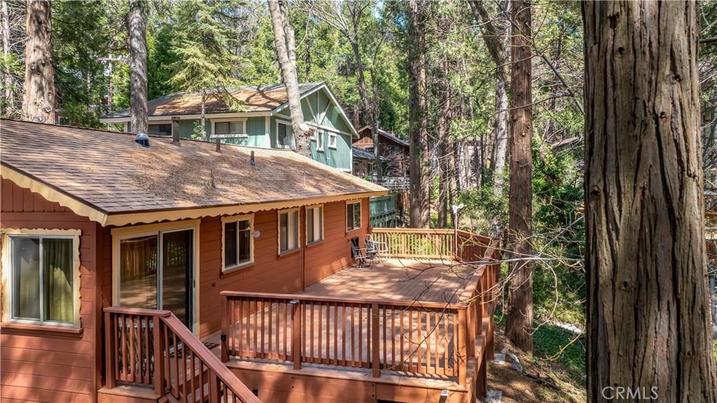 wooden deck featuring a wooded view