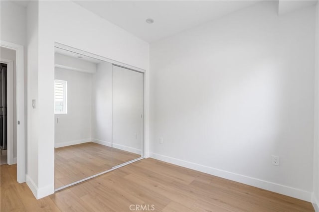 4641 W 130th St, Hawthorne, CA 90250 - unfurnished bedroom featuring light wood-type flooring, a closet, and baseboards