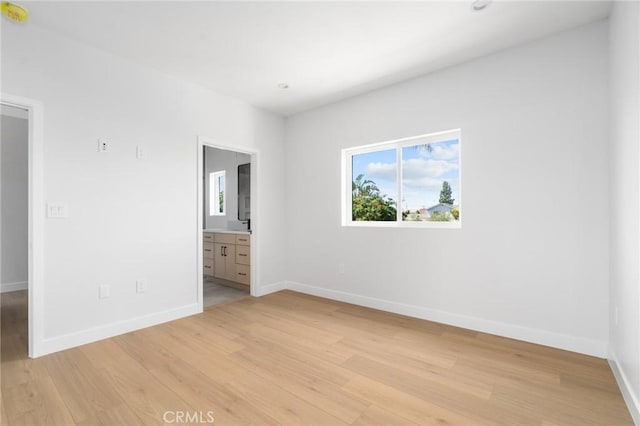 4641 W 130th St, Hawthorne, CA 90250 - unfurnished bedroom with light wood-style floors, baseboards, and ensuite bathroom