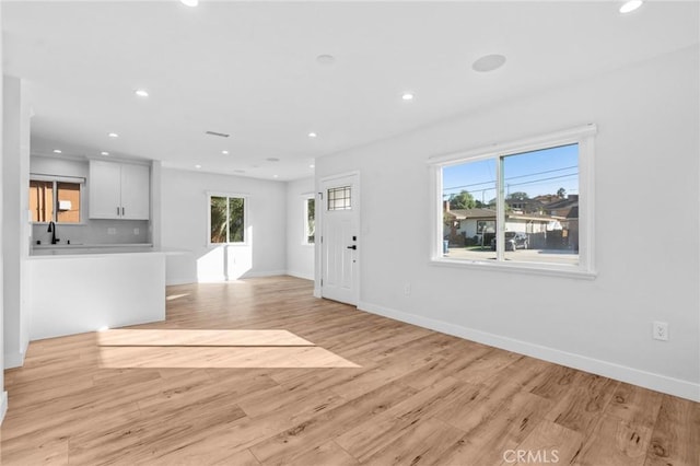 4641 W 130th St, Hawthorne, CA 90250 - unfurnished living room featuring light wood-type flooring, recessed lighting, and baseboards