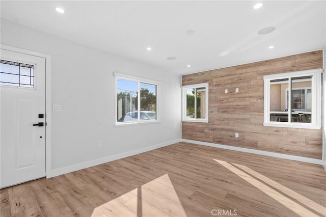 4641 W 130th St, Hawthorne, CA 90250 - foyer with wood walls, healthy amount of natural light, recessed lighting, wood finished floors, and baseboards