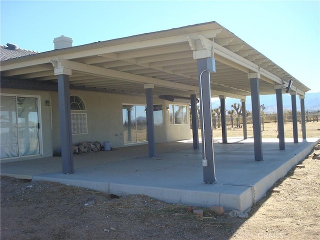 view of patio / terrace featuring a carport
