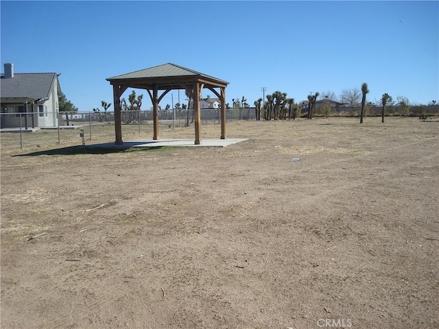 view of yard with fence and a gazebo