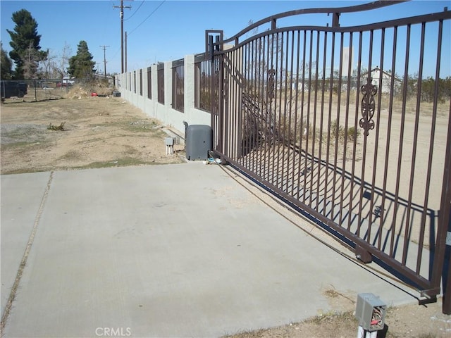 view of gate with fence