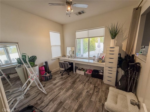 office area featuring ceiling fan, visible vents, plenty of natural light, and wood finished floors