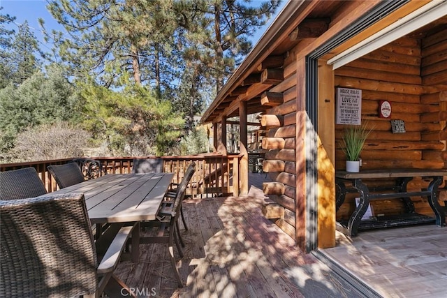 deck featuring outdoor dining area