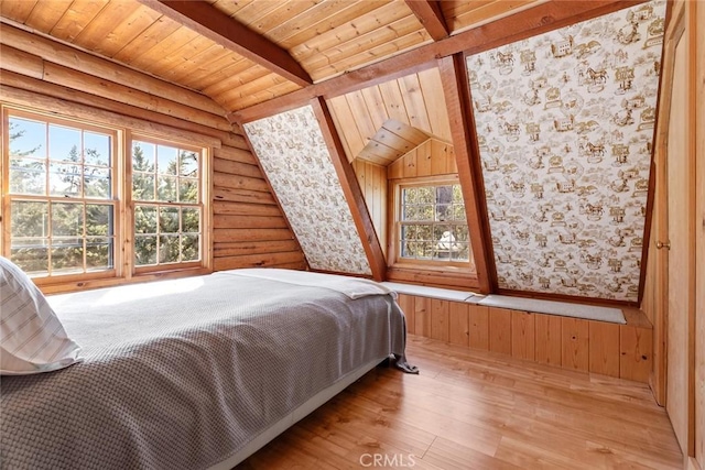 bedroom featuring wood ceiling, vaulted ceiling with beams, and wood finished floors
