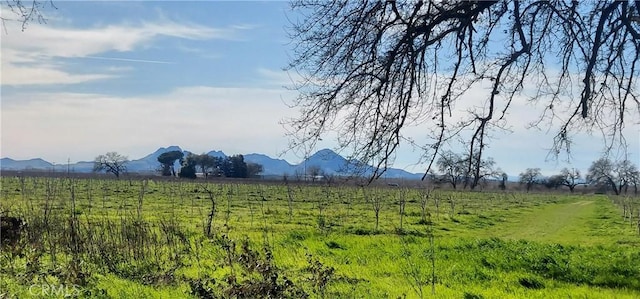 mountain view featuring a rural view