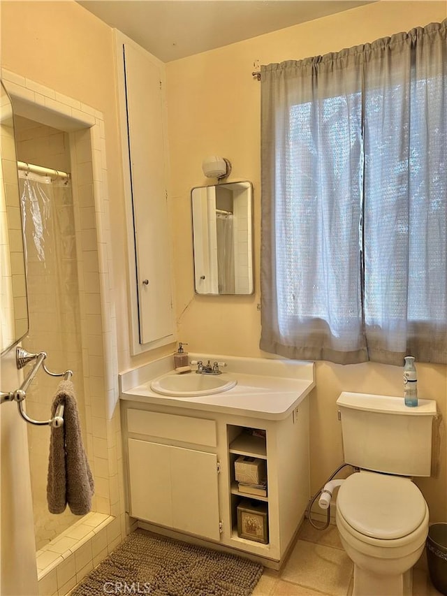 bathroom featuring a shower with curtain, toilet, and vanity