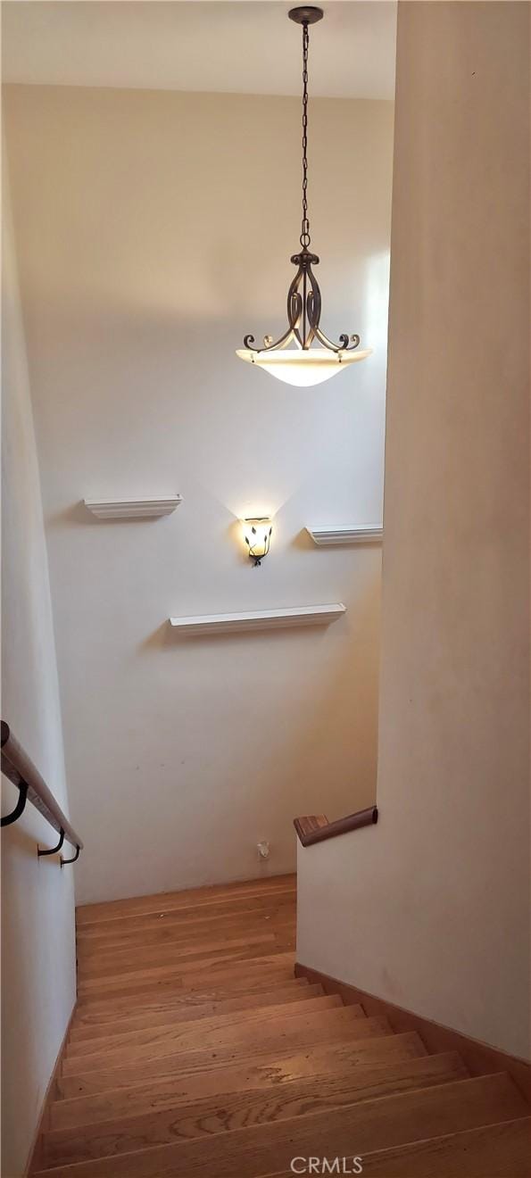 stairs with wood finished floors
