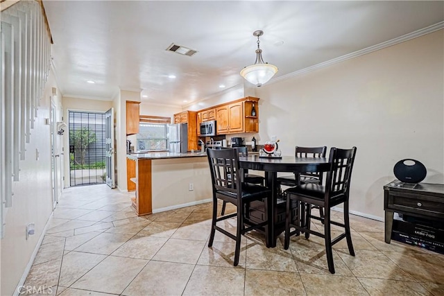 25301 Pine Creek Ln, Wilmington, CA 90744 - dining area with ornamental molding, baseboards, recessed lighting, and light tile patterned floors