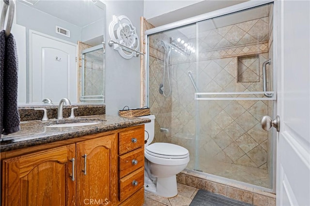 25301 Pine Creek Ln, Wilmington, CA 90744 - bathroom with vanity, tile patterned floors, toilet, and a stall shower
