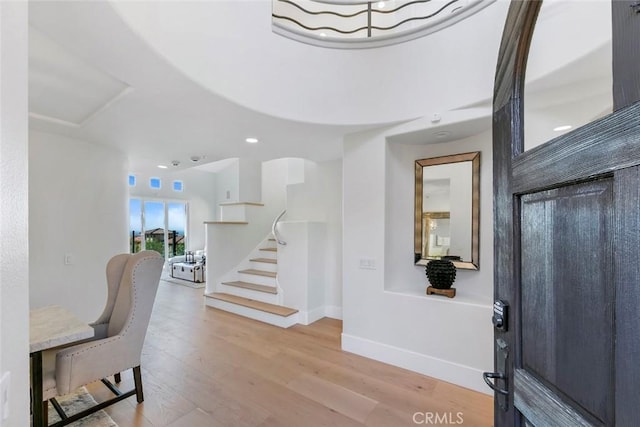 7 Suprema Dr, Newport Coast, CA 92657 - foyer entrance with stairway, light wood-style floors, baseboards, and recessed lighting