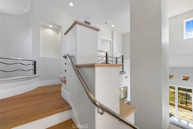 7 Suprema Dr, Newport Coast, CA 92657 - stairs featuring wood finished floors, plenty of natural light, baseboards, and recessed lighting