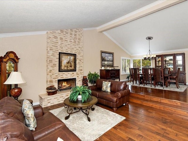 2565 Cliff Rd, Upland, CA 91784 - living area featuring an inviting chandelier, crown molding, hardwood / wood-style flooring, a fireplace, and vaulted ceiling with beams
