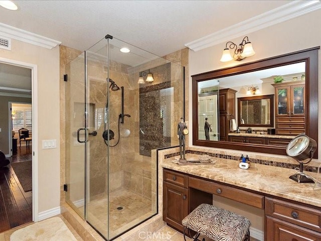 2565 Cliff Rd, Upland, CA 91784 - bathroom with a stall shower, recessed lighting, ornamental molding, visible vents, and vanity