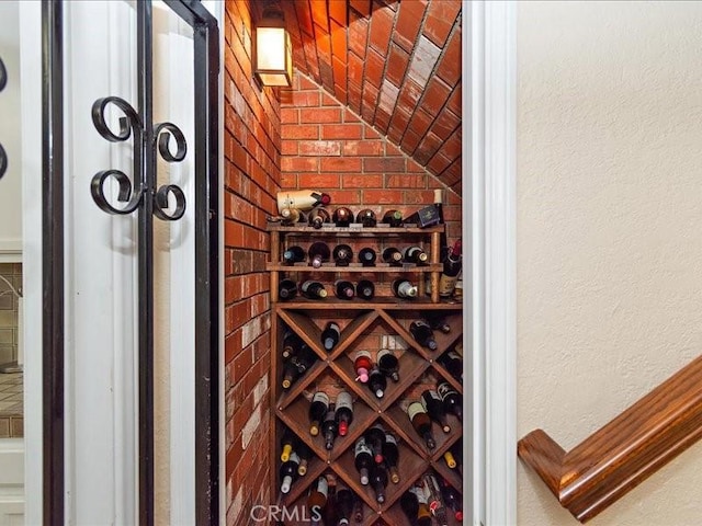 2565 Cliff Rd, Upland, CA 91784 - wine room with vaulted ceiling and a textured wall