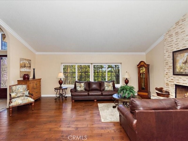 2565 Cliff Rd, Upland, CA 91784 - living area with baseboards, a stone fireplace, ornamental molding, wood-type flooring, and arched walkways