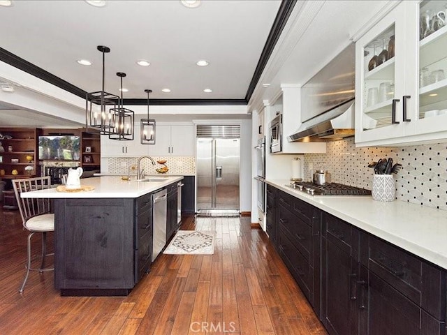 2565 Cliff Rd, Upland, CA 91784 - kitchen with a sink, built in appliances, ornamental molding, white cabinetry, and light countertops