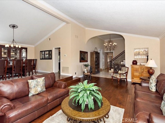 2565 Cliff Rd, Upland, CA 91784 - living room featuring a chandelier, arched walkways, wood-type flooring, ornamental molding, and lofted ceiling