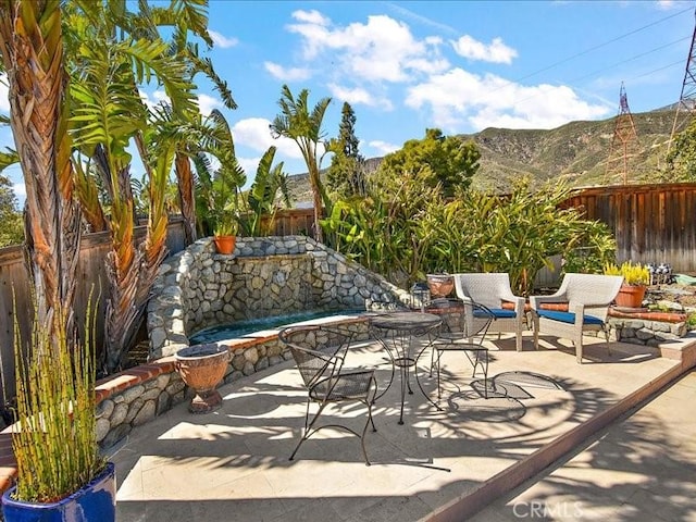 2565 Cliff Rd, Upland, CA 91784 - view of patio featuring a mountain view and a fenced backyard