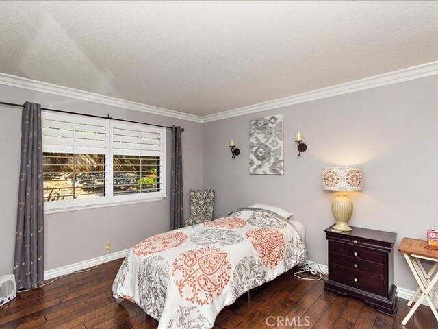 2565 Cliff Rd, Upland, CA 91784 - bedroom featuring crown molding, hardwood / wood-style flooring, and baseboards