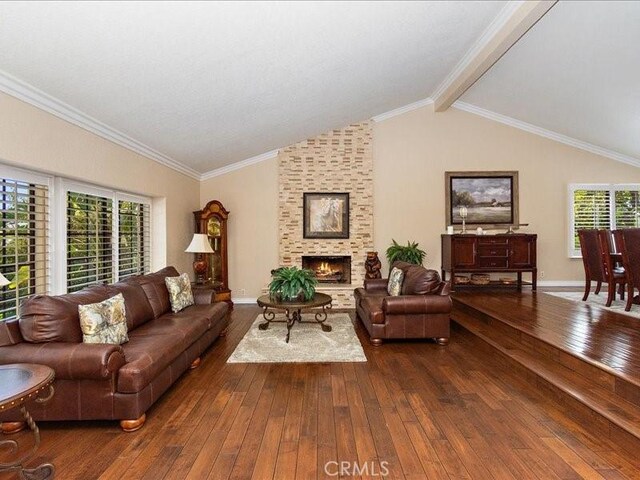 2565 Cliff Rd, Upland, CA 91784 - living area featuring dark wood finished floors, a fireplace, baseboards, and vaulted ceiling with beams