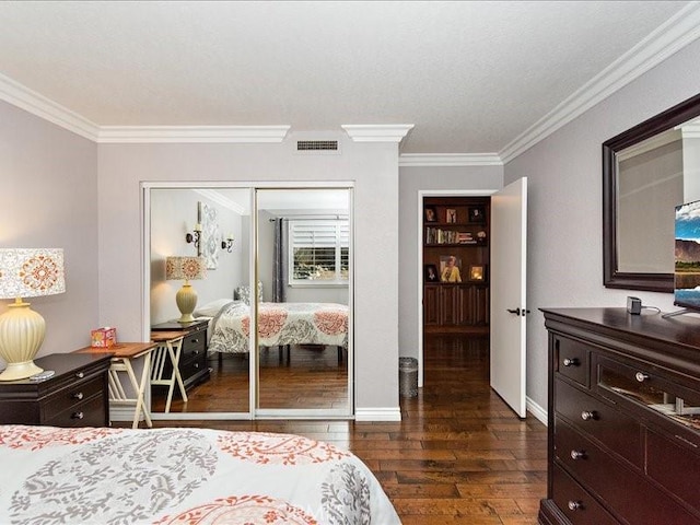 2565 Cliff Rd, Upland, CA 91784 - bedroom featuring dark wood-style flooring, ornamental molding, a closet, and visible vents