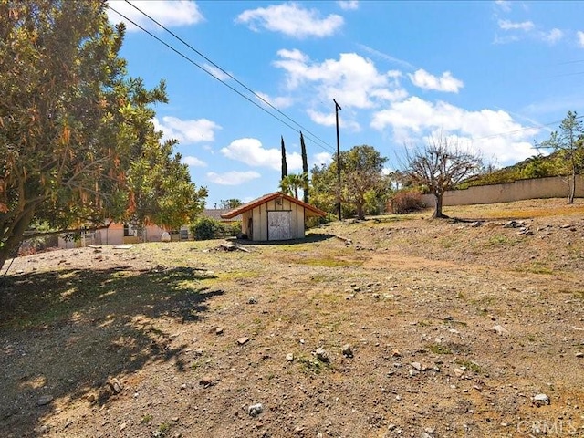 2565 Cliff Rd, Upland, CA 91784 - view of yard featuring a storage unit and a garage