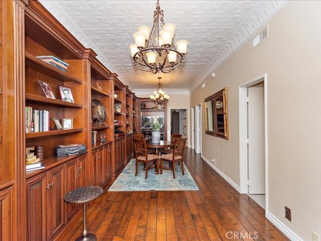 2565 Cliff Rd, Upland, CA 91784 - dining area featuring a chandelier, baseboards, dark wood-type flooring, and visible vents
