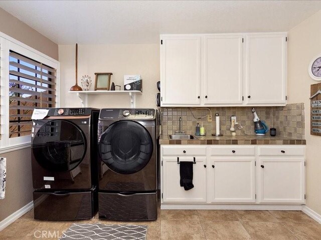 2565 Cliff Rd, Upland, CA 91784 - laundry room featuring independent washer and dryer, baseboards, a sink, and cabinet space