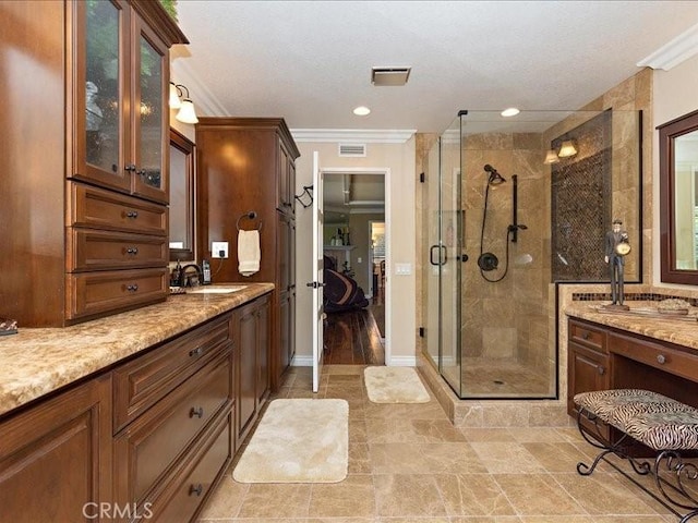 2565 Cliff Rd, Upland, CA 91784 - bathroom with a stall shower, vanity, ornamental molding, and visible vents