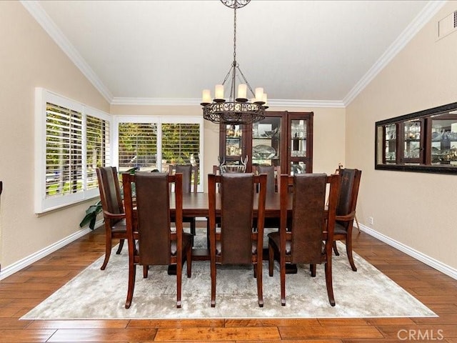 2565 Cliff Rd, Upland, CA 91784 - dining space with baseboards, ornamental molding, visible vents, wood-type flooring, and a chandelier