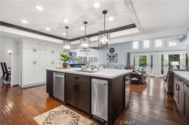 2565 Cliff Rd, Upland, CA 91784 - kitchen with stainless steel dishwasher, open floor plan, light countertops, dark brown cabinetry, and crown molding
