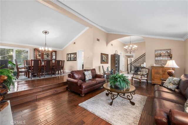 2565 Cliff Rd, Upland, CA 91784 - living room with a chandelier, arched walkways, crown molding, hardwood / wood-style flooring, and stairs