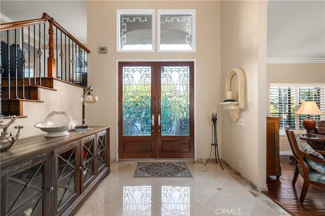2565 Cliff Rd, Upland, CA 91784 - entrance foyer featuring french doors, light tile patterned floors, ornamental molding, stairway, and a high ceiling
