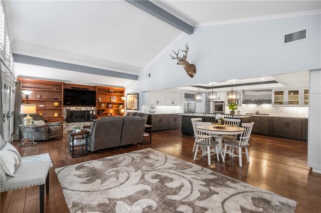 2565 Cliff Rd, Upland, CA 91784 - living area featuring dark wood finished floors, beam ceiling, ornamental molding, and high vaulted ceiling