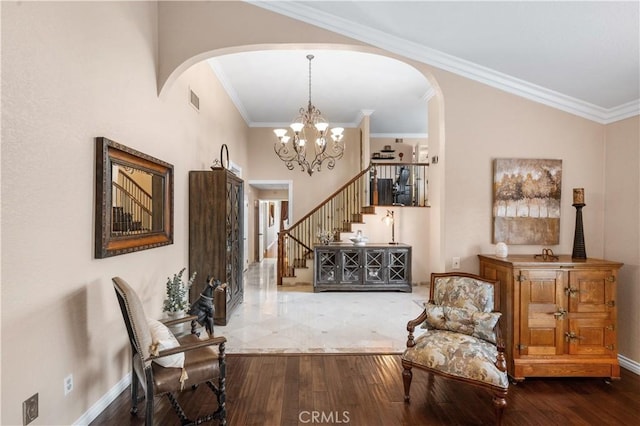 2565 Cliff Rd, Upland, CA 91784 - living area with arched walkways, stairs, wood-type flooring, ornamental molding, and a chandelier