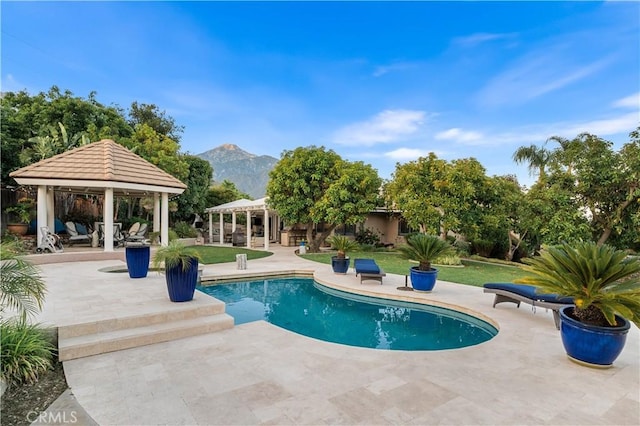 2565 Cliff Rd, Upland, CA 91784 - outdoor pool with a gazebo, a patio area, a mountain view, and a lawn