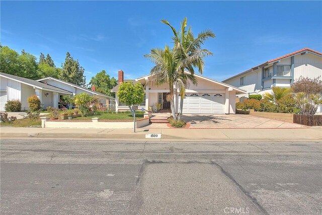 view of front of property featuring driveway and a garage