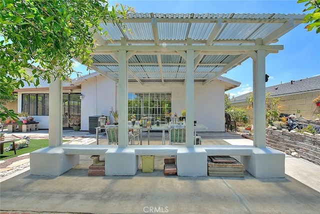 view of patio featuring a pergola and outdoor dining area
