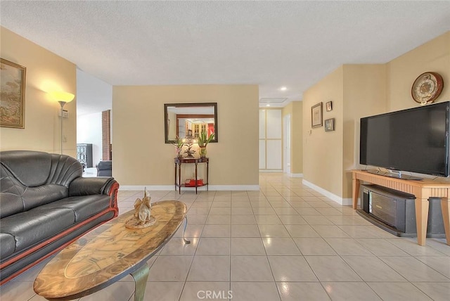 living area with baseboards, light tile patterned floors, and recessed lighting