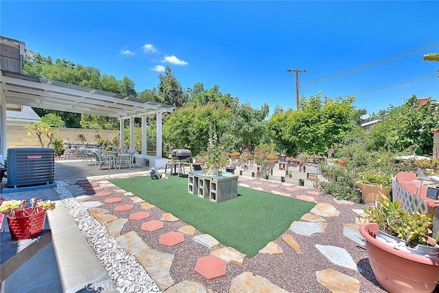 view of yard with cooling unit, a patio, and fence