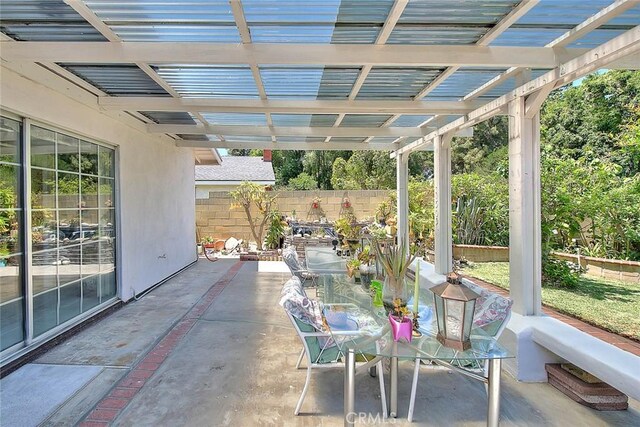 view of patio / terrace with fence, outdoor dining area, and a pergola