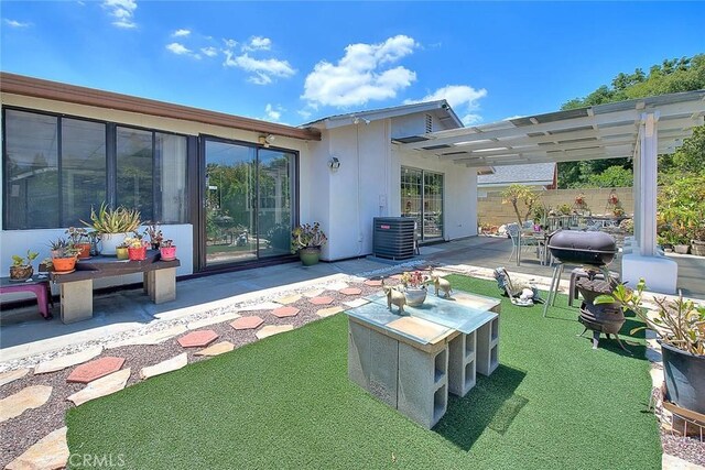 rear view of property with a patio, central AC unit, a pergola, fence, and stucco siding