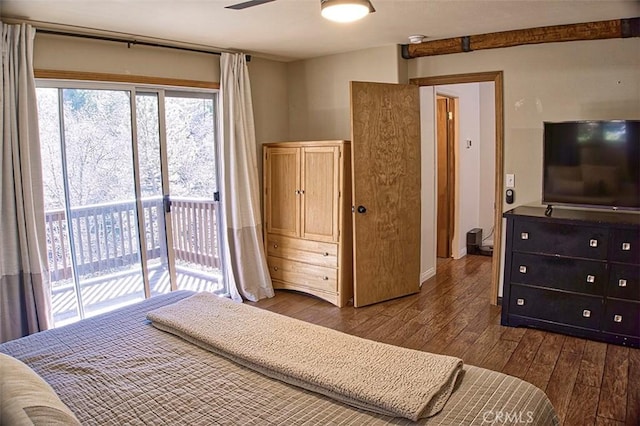 bedroom featuring dark wood-type flooring and access to outside