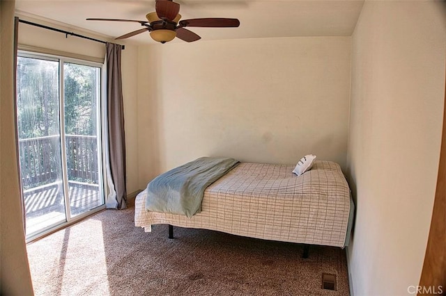 carpeted bedroom with a ceiling fan and access to outside