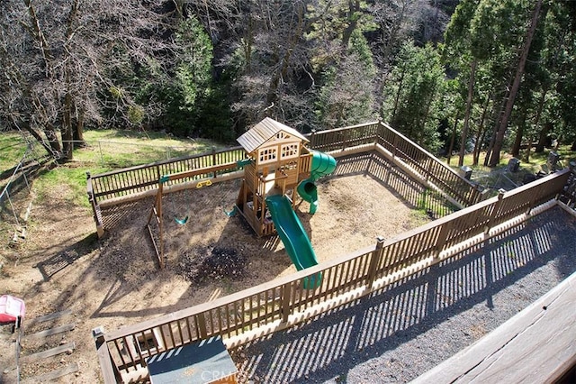 exterior space with a fenced backyard and a playground