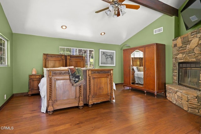 12617 Koenigstein Rd, Santa Paula, CA 93060 - bedroom featuring dark wood-type flooring, baseboards, visible vents, vaulted ceiling with beams, and a fireplace